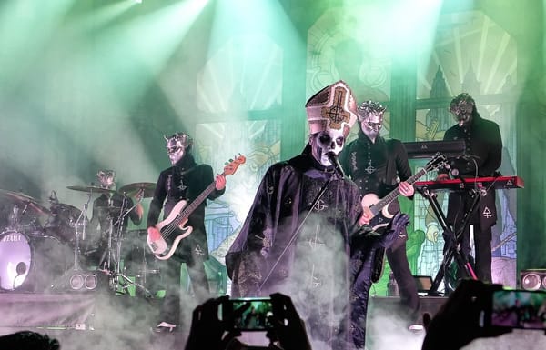 The Swedish rock band Ghost, performing live in full costume.